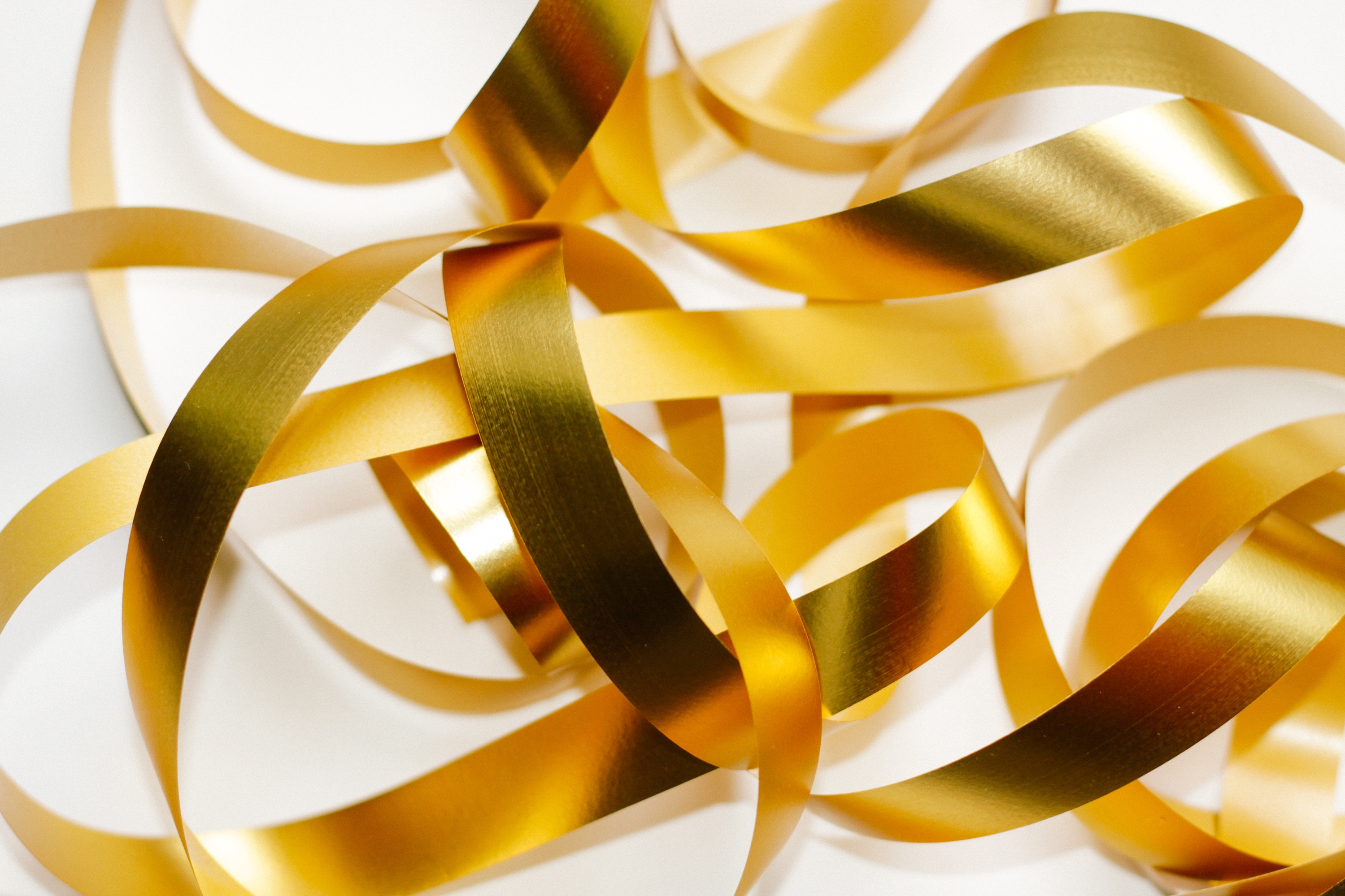 Metallic ribbon added to floral arrangements for festivals